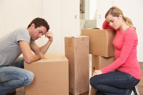 Boxes and furniture being packed into a mobile storage container